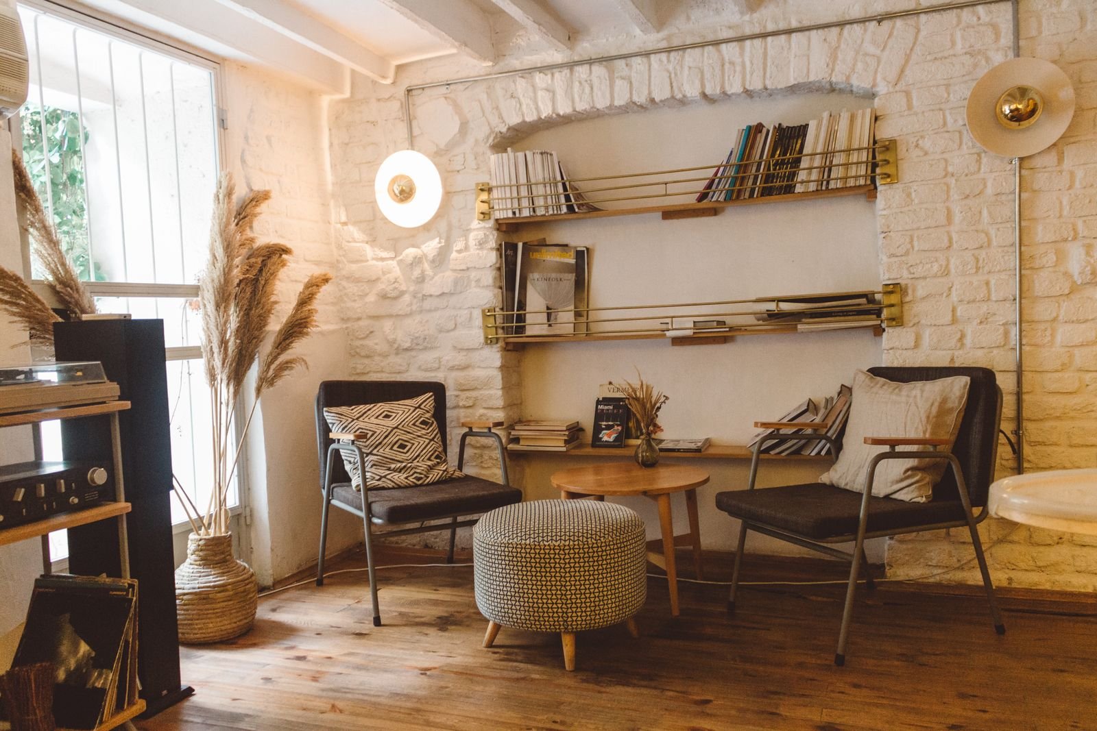 Upholstered armchairs and a patterned ottoman