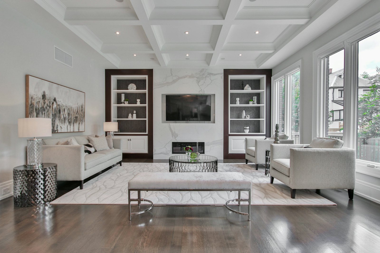A formal living room with a marble feature wall